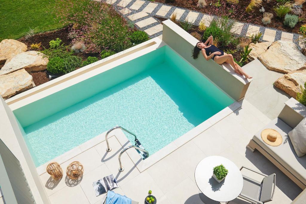 The swimming pool at or close to Cavo Delea Villas & Suites
