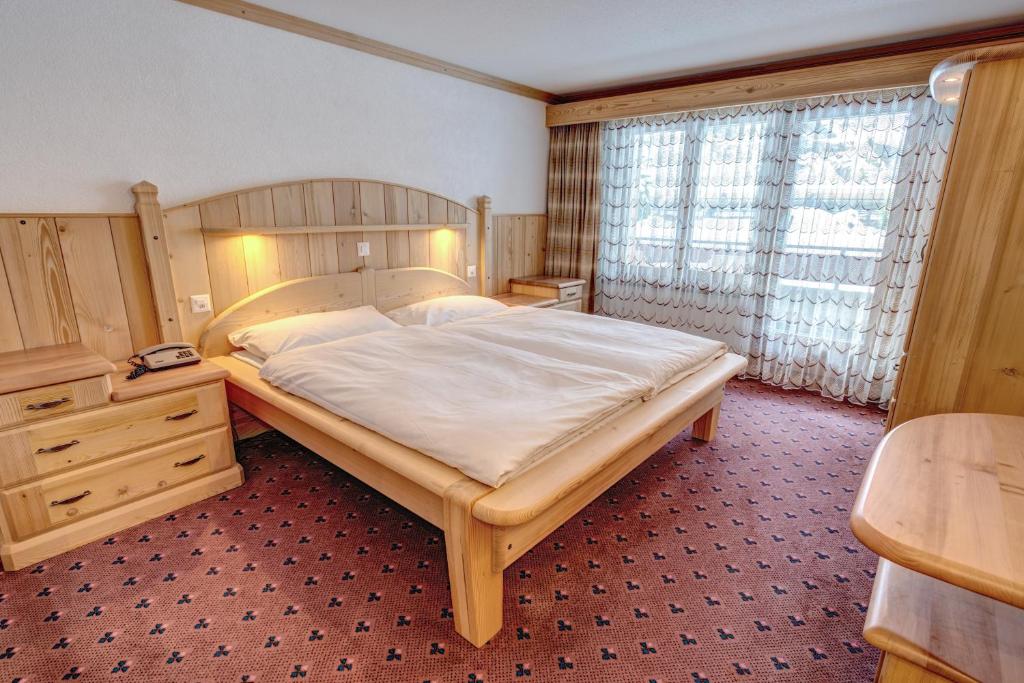 Postel nebo postele na pokoji v ubytování Hotel City