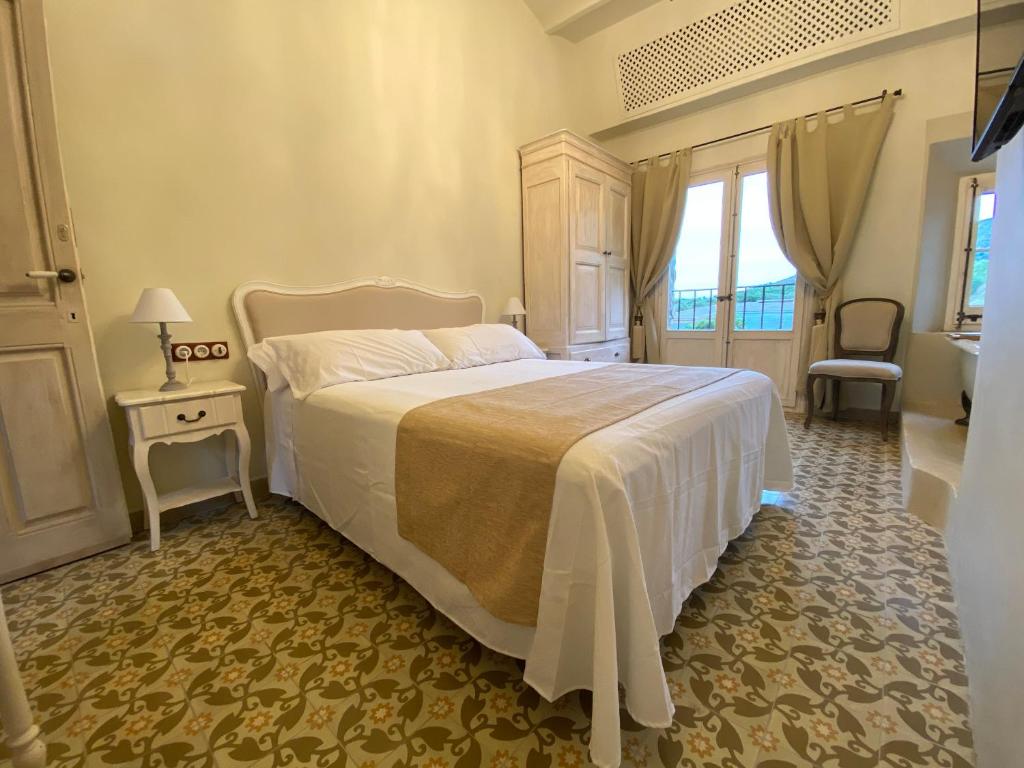 A bed or beds in a room at Can Massana