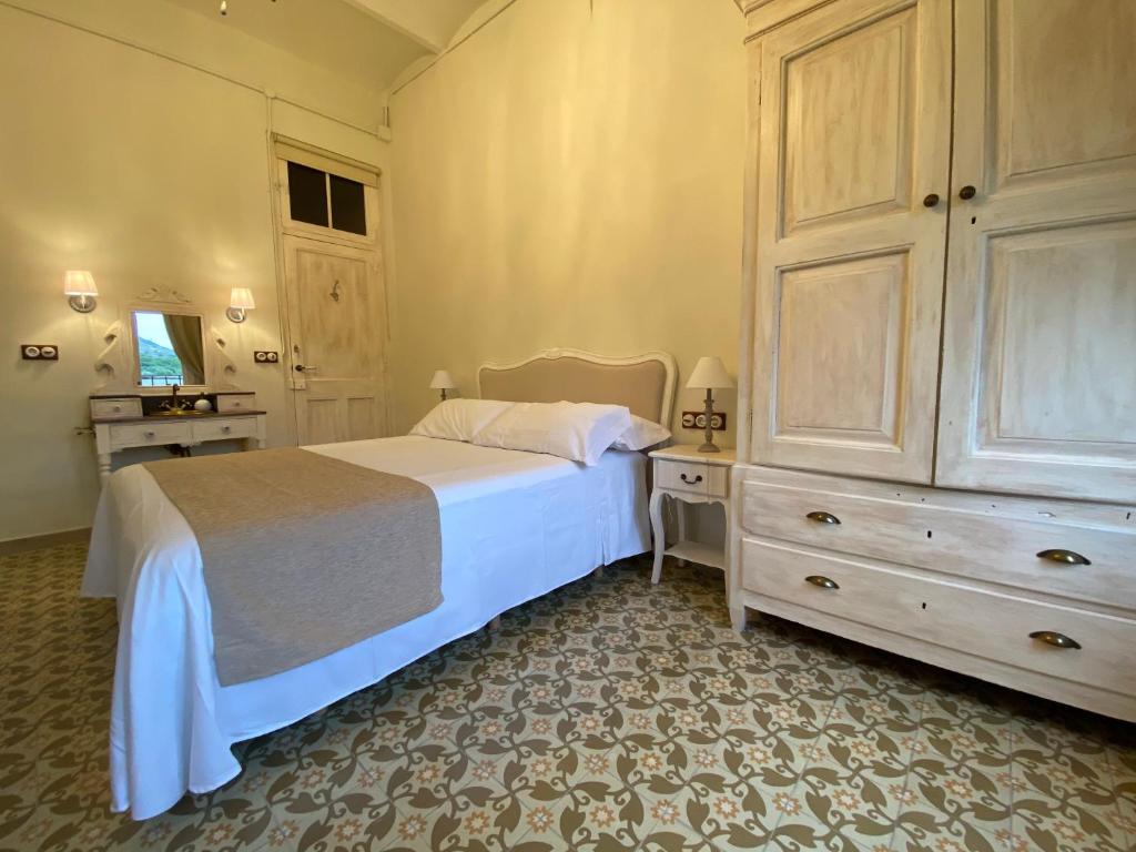 A bed or beds in a room at Can Massana