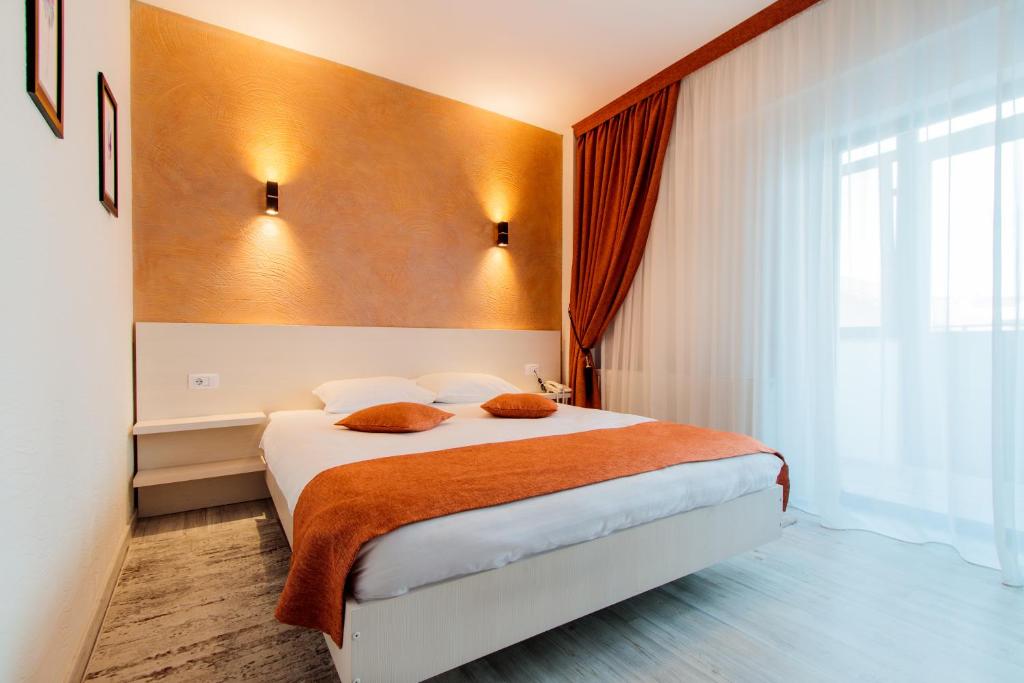 Postel nebo postele na pokoji v ubytování Hotel Bulevard