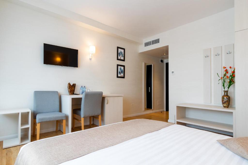 Postel nebo postele na pokoji v ubytování Hotel Bulevard