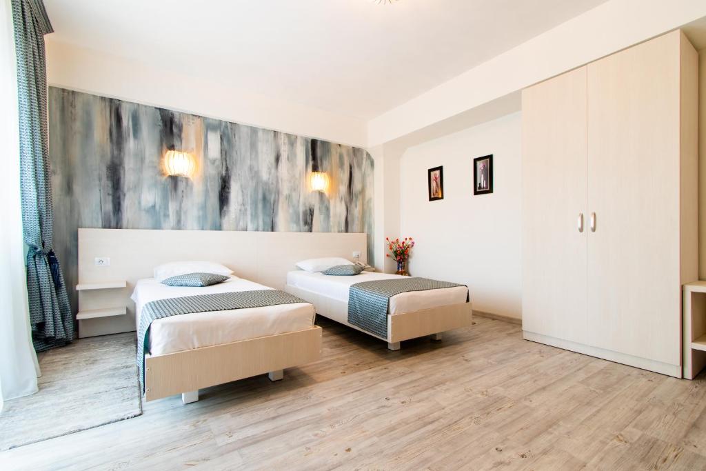 Postel nebo postele na pokoji v ubytování Hotel Bulevard