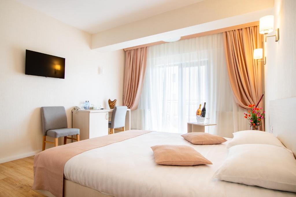 Postel nebo postele na pokoji v ubytování Hotel Bulevard