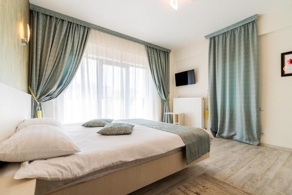Postel nebo postele na pokoji v ubytování Hotel Bulevard