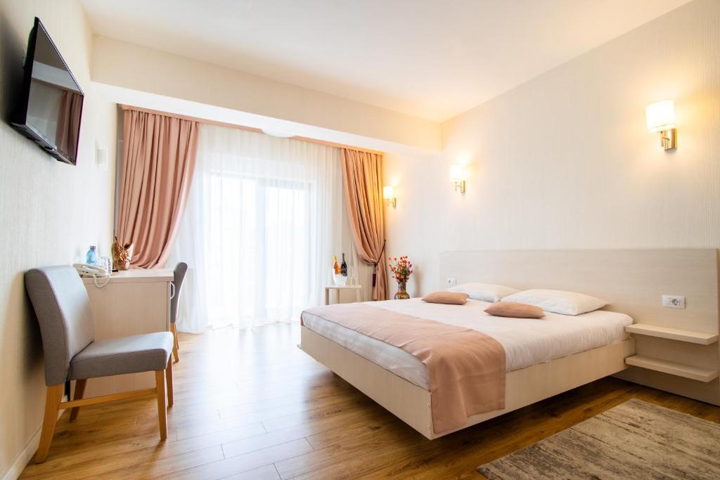 Postel nebo postele na pokoji v ubytování Hotel Bulevard
