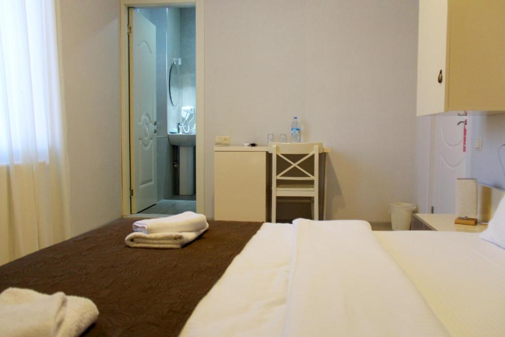Postel nebo postele na pokoji v ubytování Hotel Casa calda