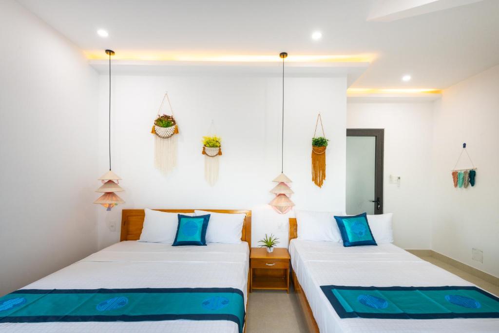 Postel nebo postele na pokoji v ubytování Hoi An Village Villa