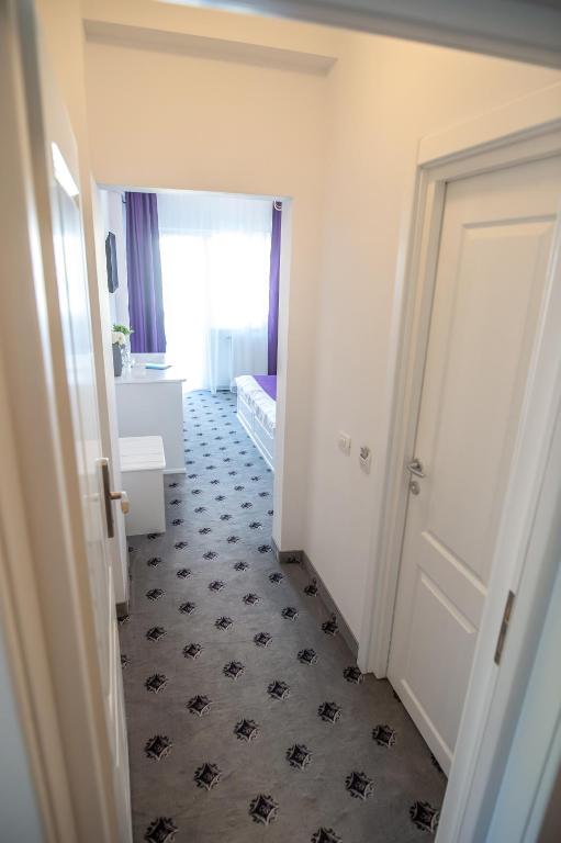 Postel nebo postele na pokoji v ubytování Hotel Tadora