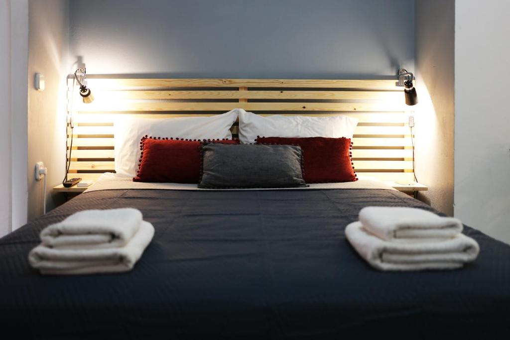 A bed or beds in a room at Halepa Apartments