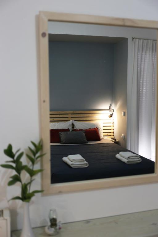 A bed or beds in a room at Halepa Apartments