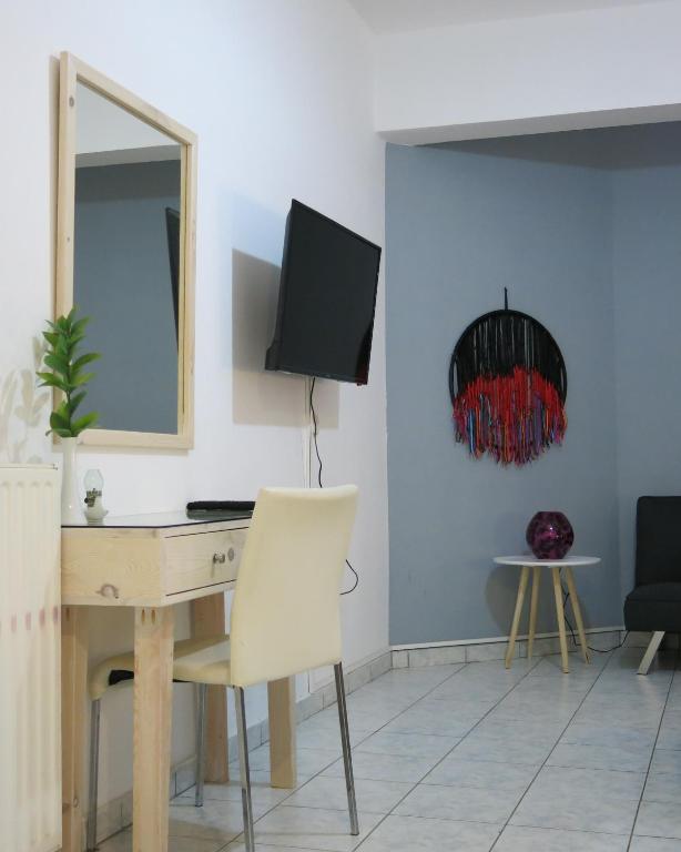 A television and/or entertainment centre at Halepa Apartments