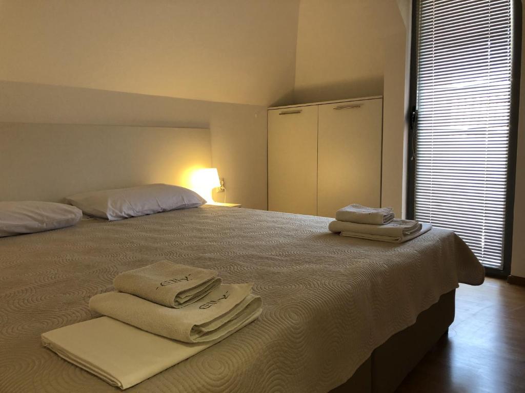Postel nebo postele na pokoji v ubytování Aparthotel Elly