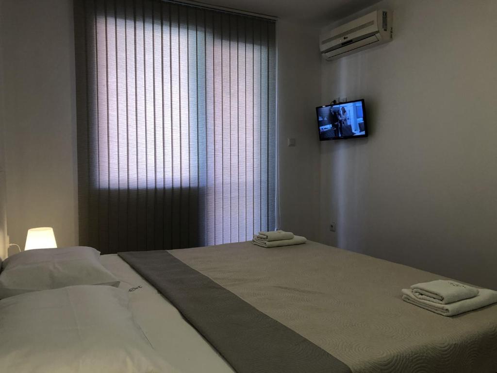 Postel nebo postele na pokoji v ubytování Aparthotel Elly