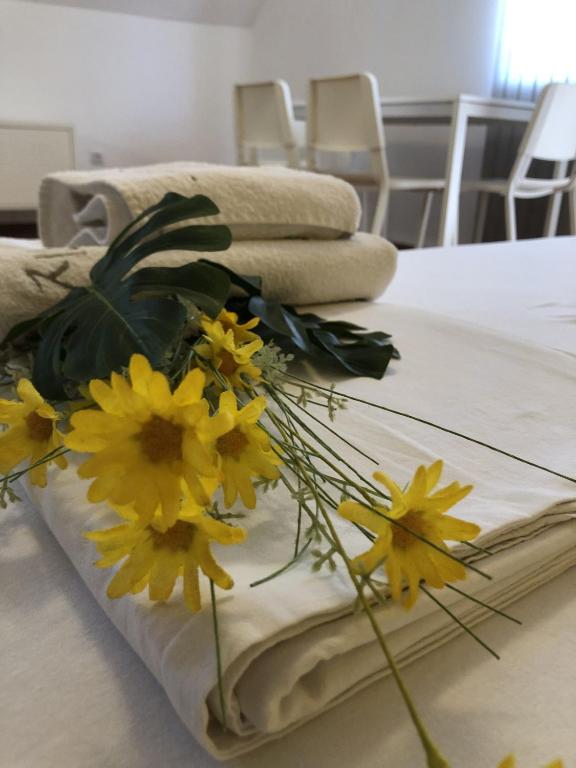 Postel nebo postele na pokoji v ubytování Aparthotel Elly