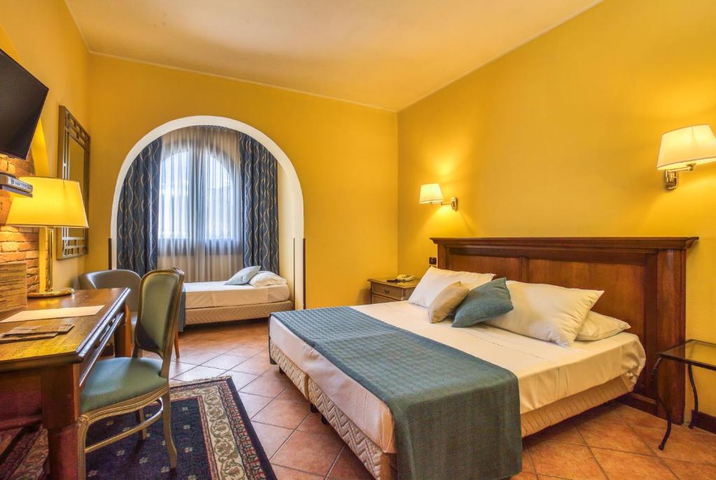 Postel nebo postele na pokoji v ubytování Hotel San Giorgio