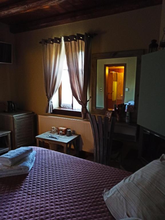 Postel nebo postele na pokoji v ubytování Foris House