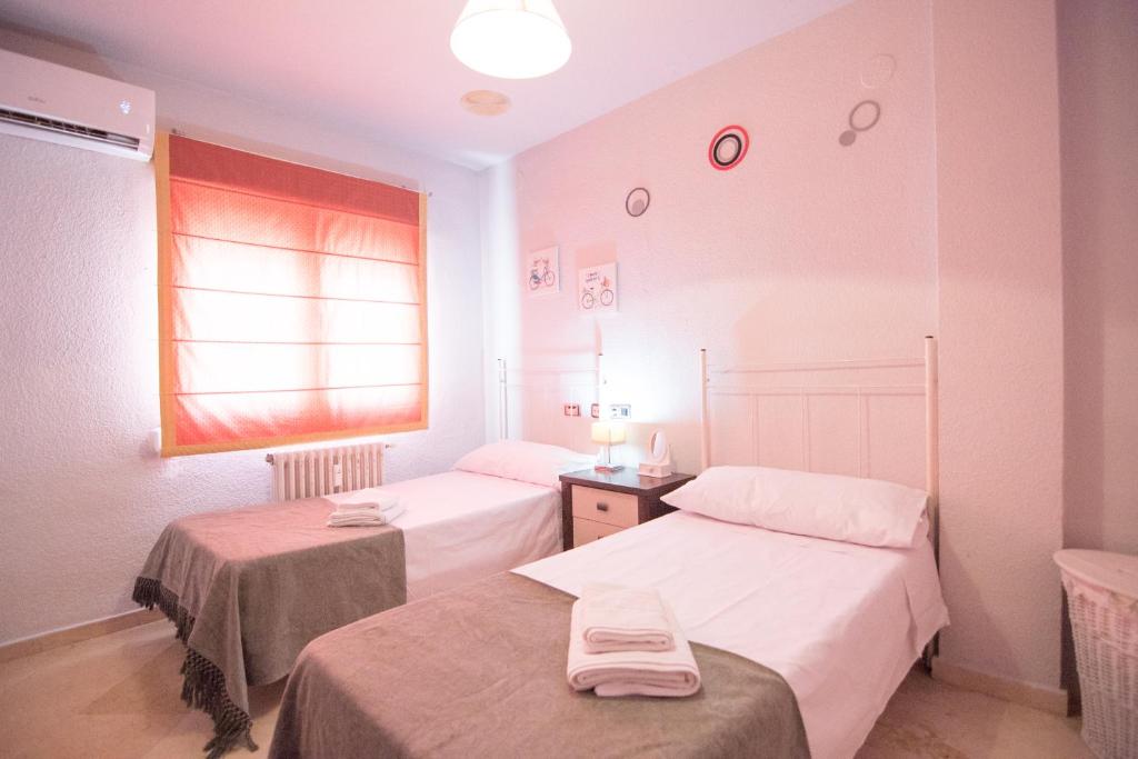Postel nebo postele na pokoji v ubytování Lope de Vega Apartment