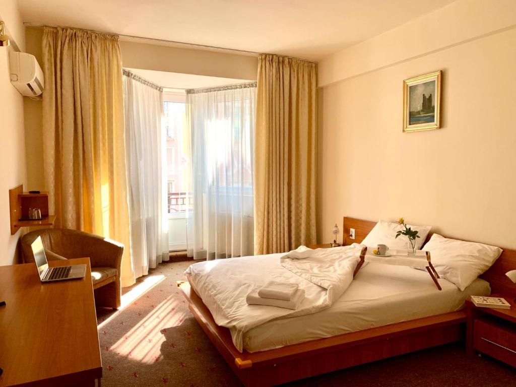 Ліжко або ліжка в номері Hotel Victoria