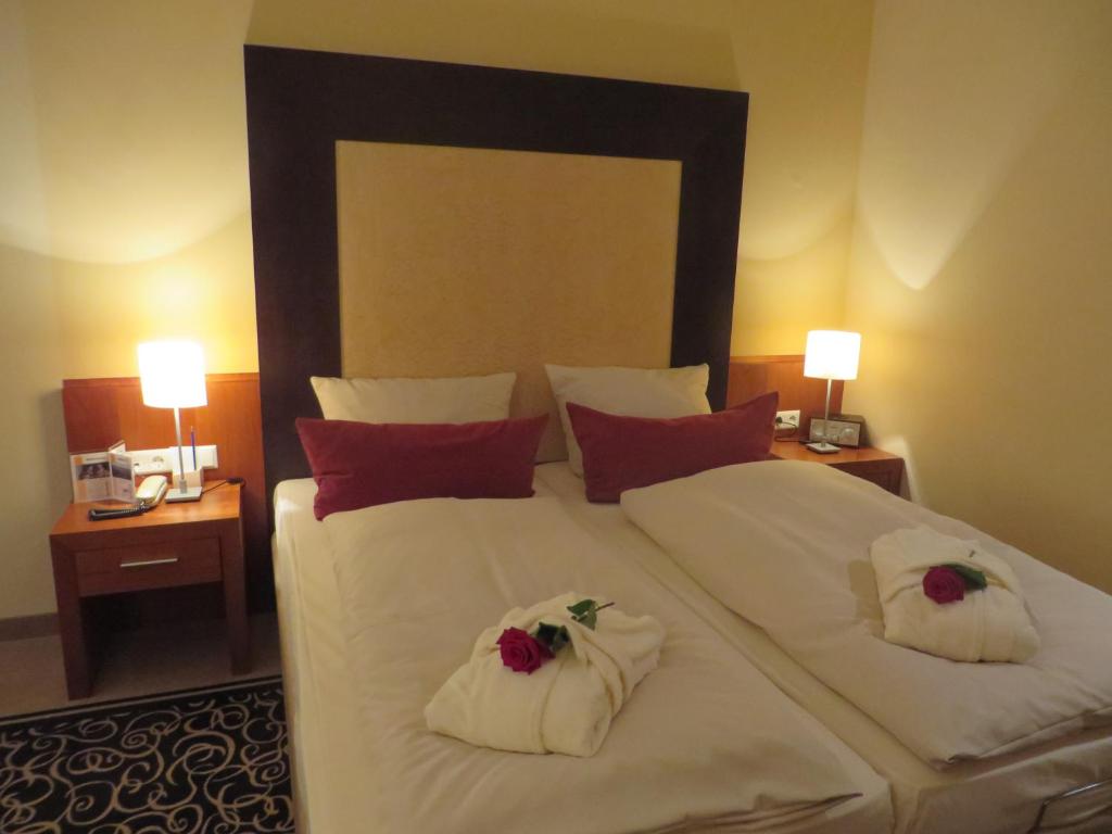 Postel nebo postele na pokoji v ubytování Ringhotel Bundschu