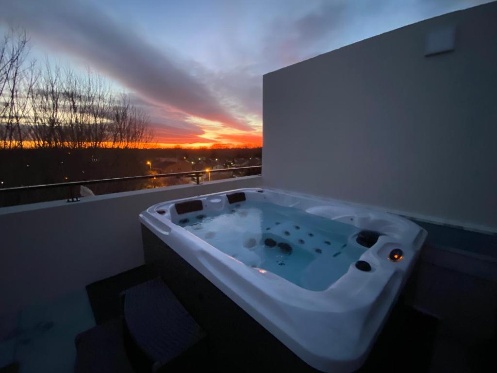 a bath tub in a room with a sunset at Le petit paradis de Valentin in Argelès-sur-Mer