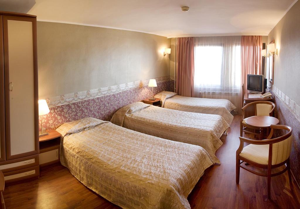 Postel nebo postele na pokoji v ubytování Aneli Hotel