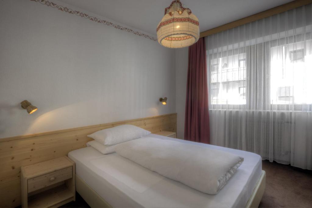 Postel nebo postele na pokoji v ubytování Hotel La Tambra