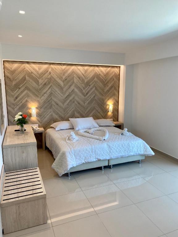 Postel nebo postele na pokoji v ubytování Agrelli Hotel & Suites