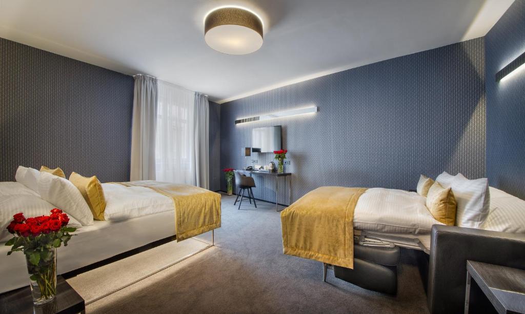 Postel nebo postele na pokoji v ubytování Hotel Mucha