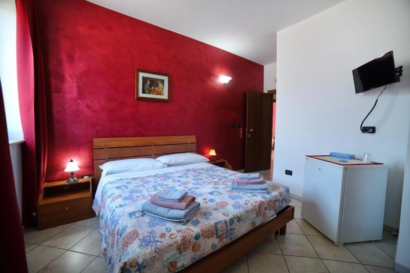 A bed or beds in a room at Maxpensione