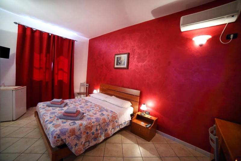 A bed or beds in a room at Maxpensione