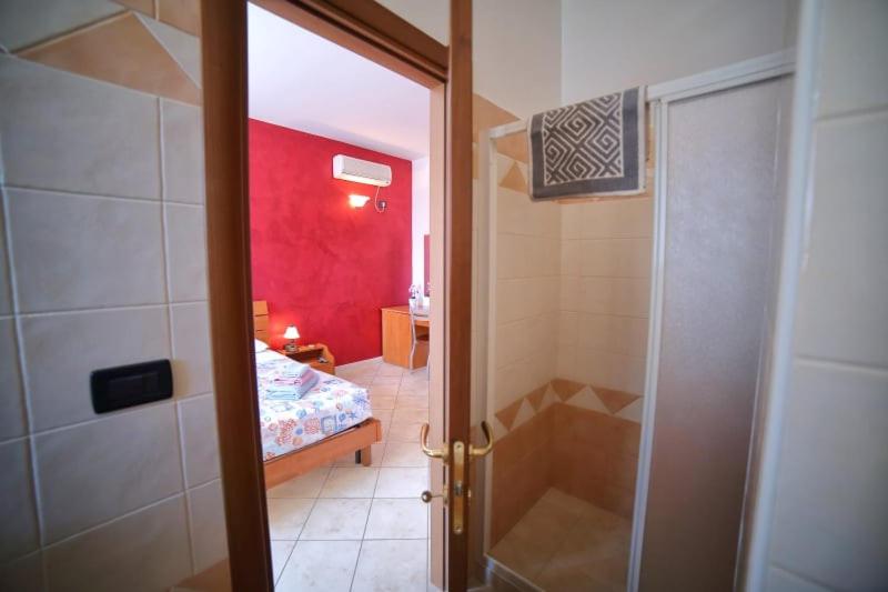 A bed or beds in a room at Maxpensione
