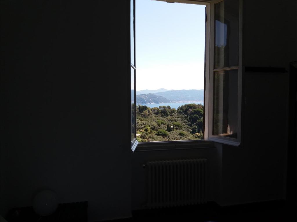 a window in a dark room with a view at Trekking in paradise B&B in Santa Margherita Ligure