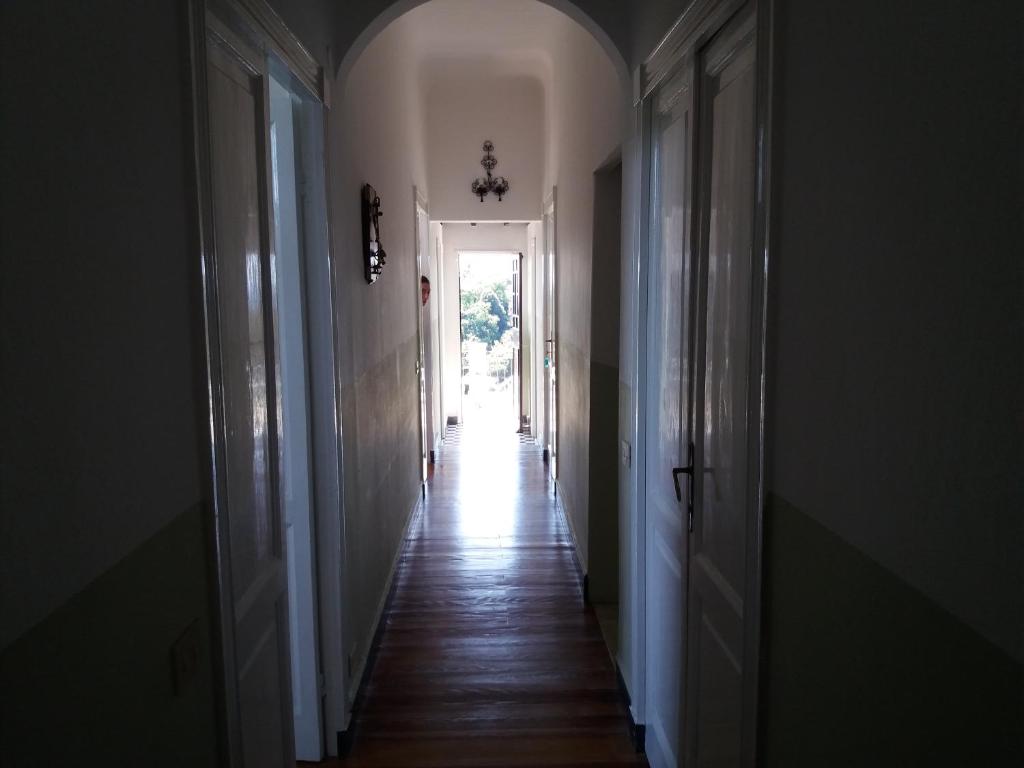 an empty hallway with a hallway leading to a door at Trekking in paradise B&B in Santa Margherita Ligure