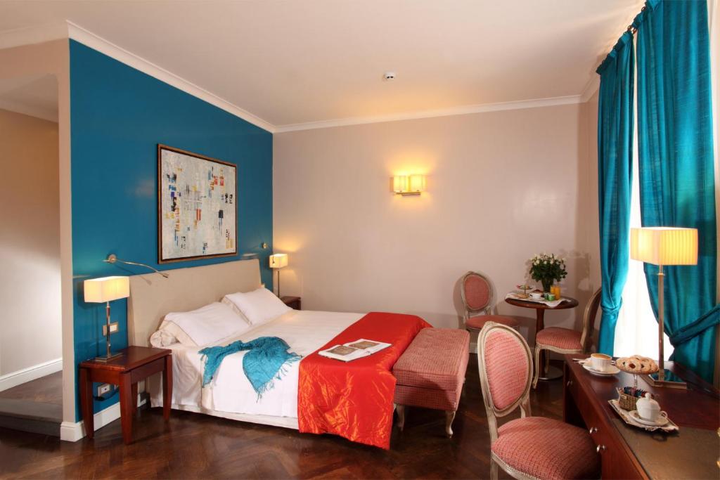 Postel nebo postele na pokoji v ubytování Hotel Mozart