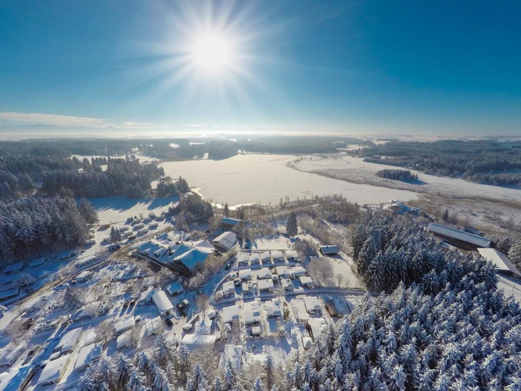 an aerial view of a resort in the snow at Allgäu-Hotel-Elbsee in Aitrang