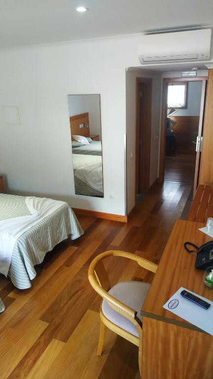 Postel nebo postele na pokoji v ubytování Hotel Comodoro