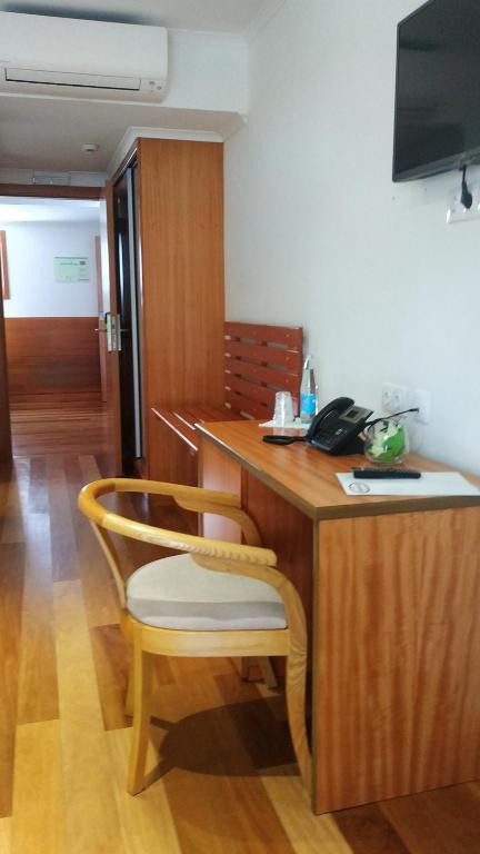 TV a/nebo společenská místnost v ubytování Hotel Comodoro