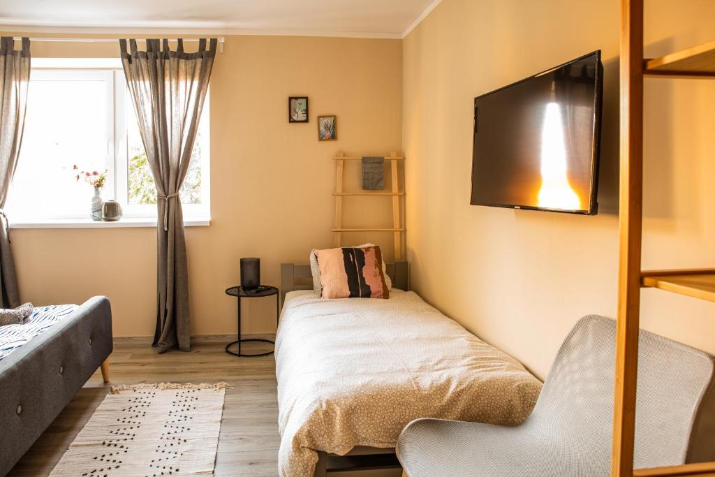 Postel nebo postele na pokoji v ubytování K-house