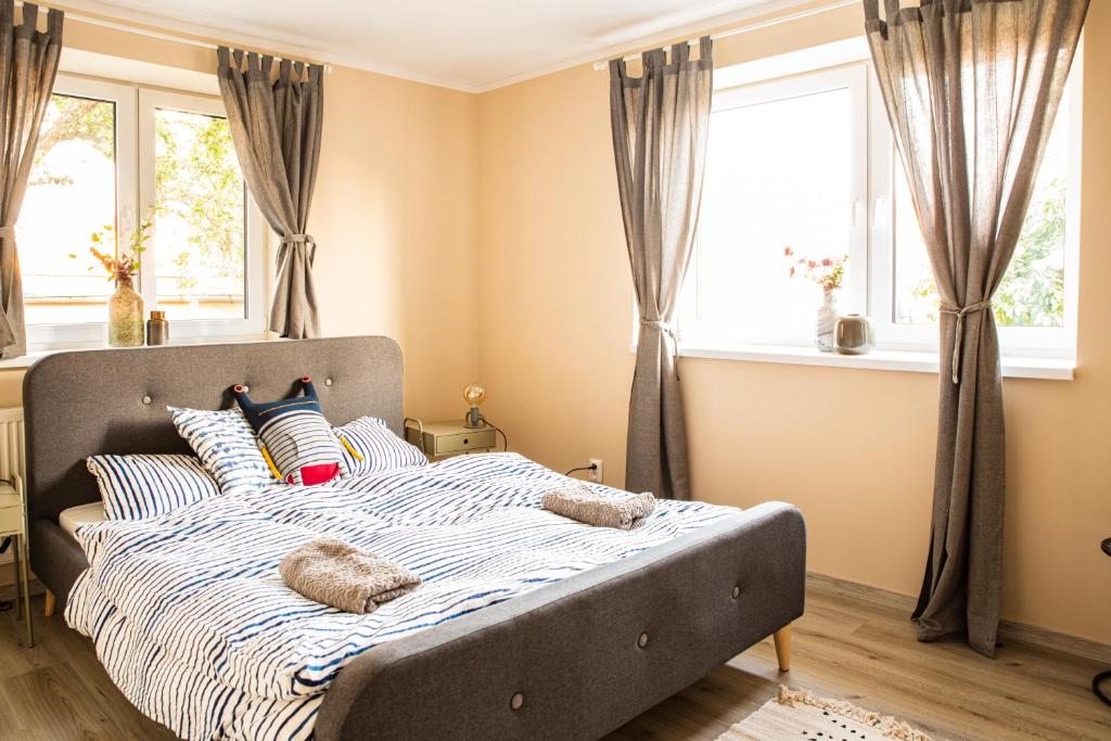 Postel nebo postele na pokoji v ubytování K-house