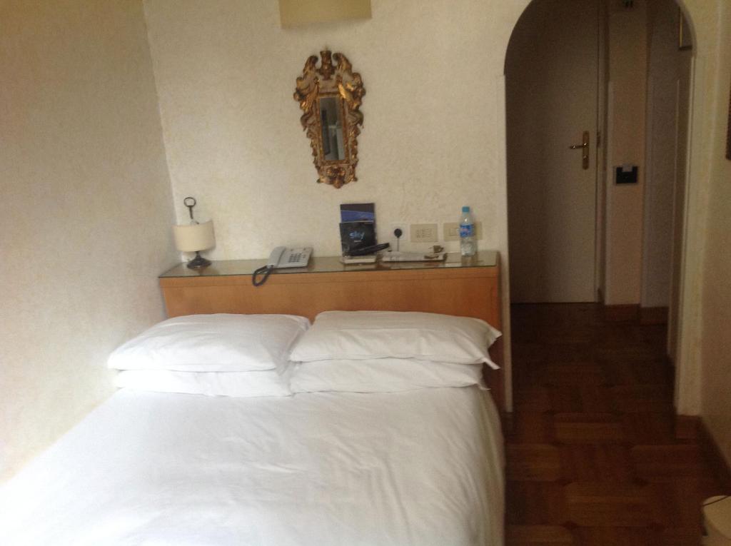 Postel nebo postele na pokoji v ubytování Hotel Fontana
