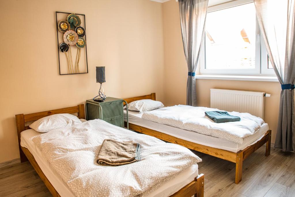 Postel nebo postele na pokoji v ubytování K-house