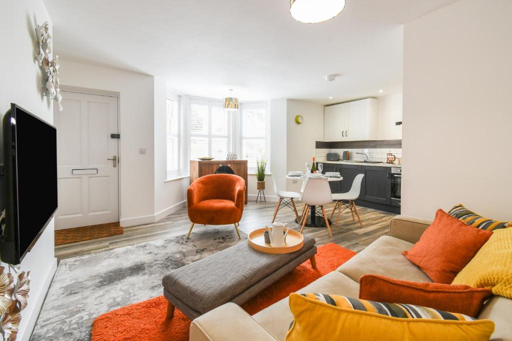 a living room with a couch and a table at Woodland View in York