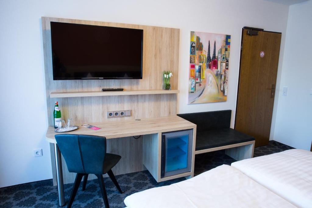 TV a/nebo společenská místnost v ubytování Hotel Wilms