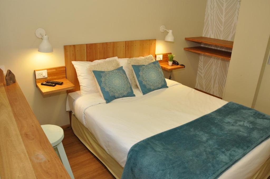 Postel nebo postele na pokoji v ubytování Posada de las Aguilas Hotel Boutique