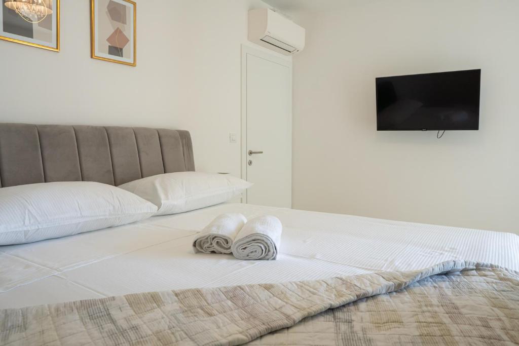 Posteľ alebo postele v izbe v ubytovaní Golden Luxury Apartment