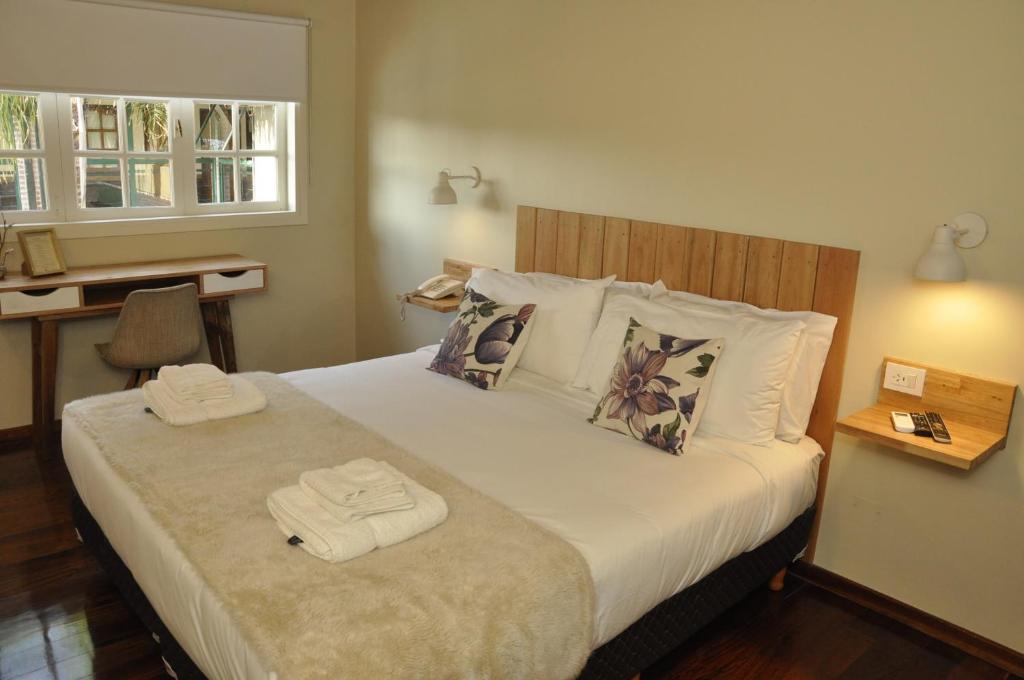 Postel nebo postele na pokoji v ubytování Posada de las Aguilas Hotel Boutique