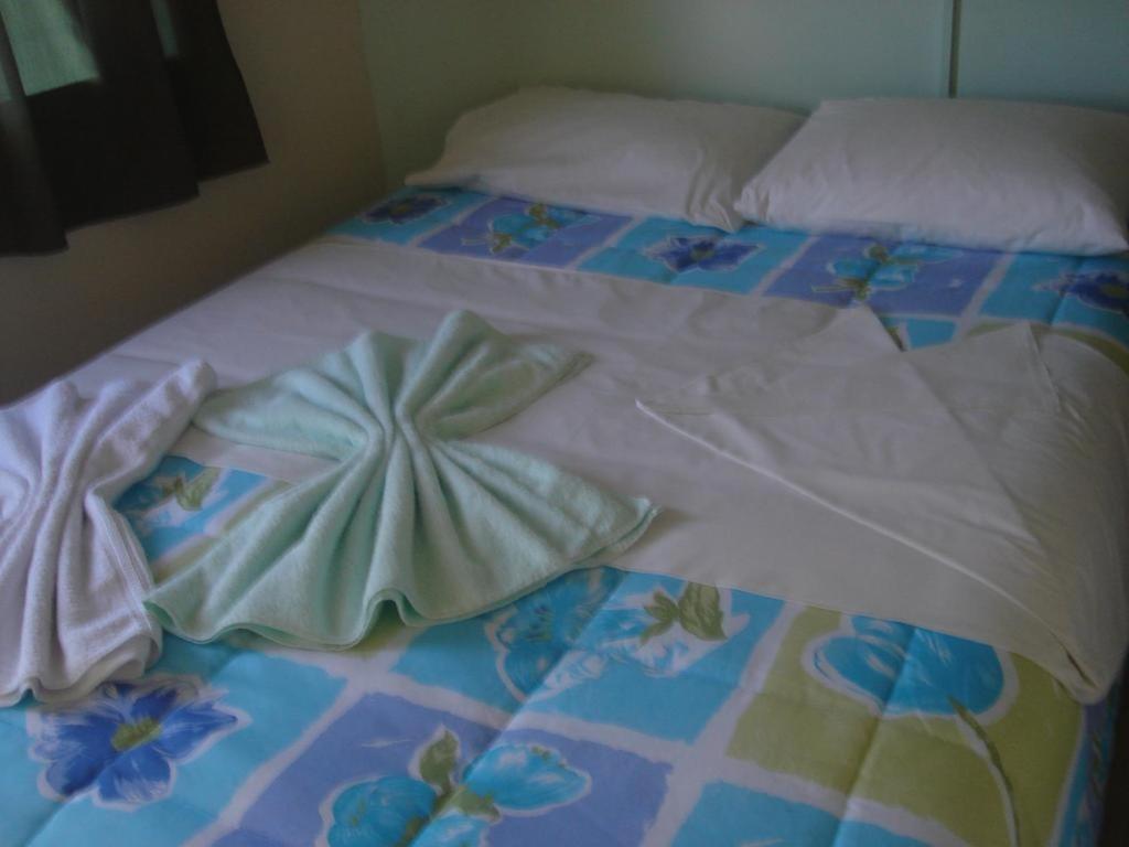 Postel nebo postele na pokoji v ubytování Hotel Alvorada