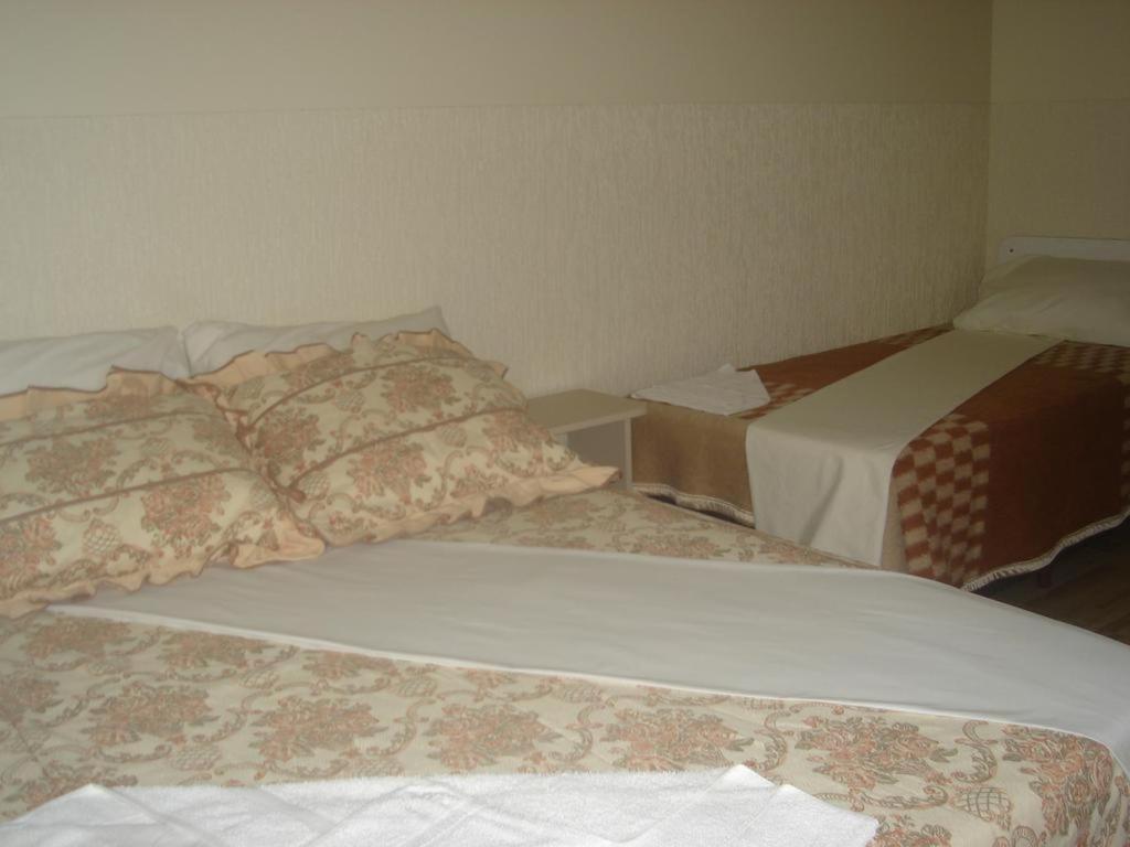 Postel nebo postele na pokoji v ubytování Hotel Alvorada