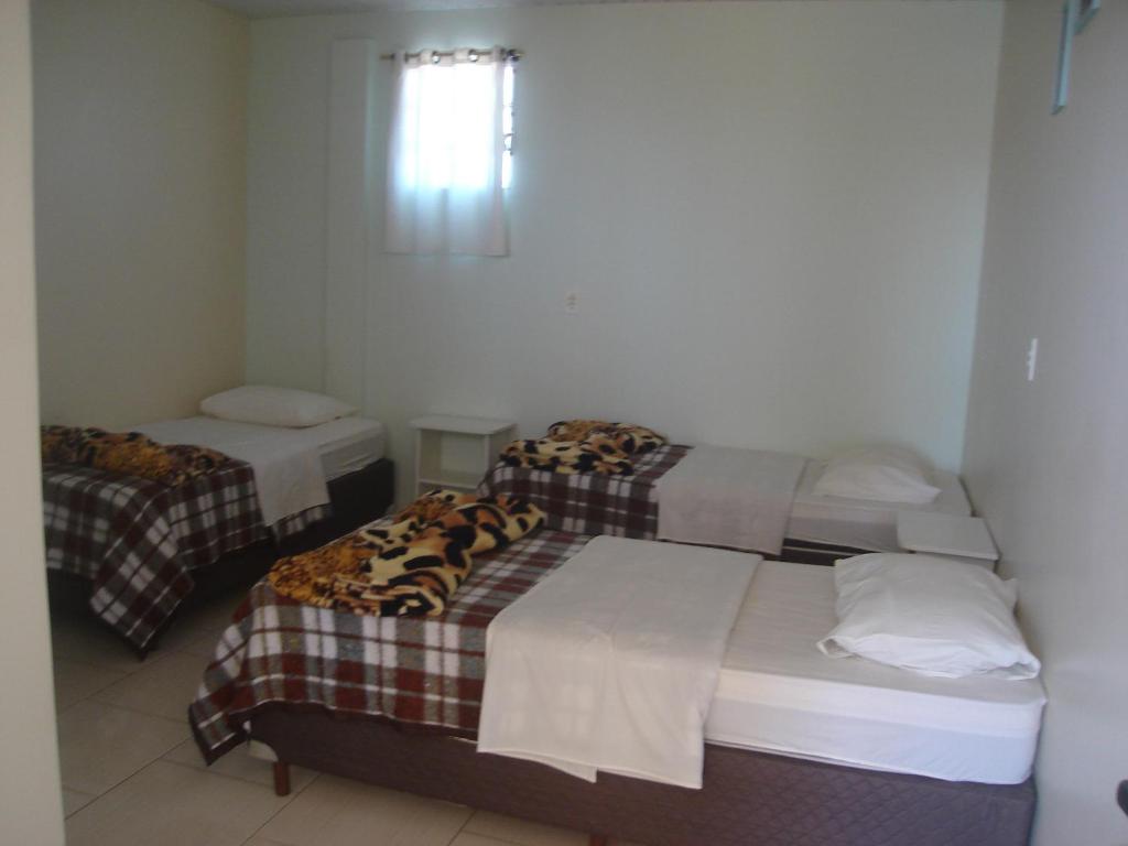 Postel nebo postele na pokoji v ubytování Hotel Alvorada